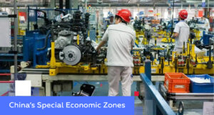 Workers in red helmets on a Chinese auto-engine assembly line — illustrating China’s Special Economic Zones (SEZ)