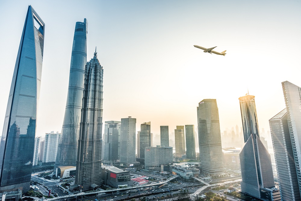 Plane fly over City