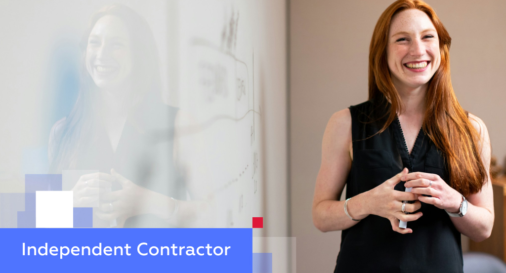 Smiling young professional in front of a glass whiteboard — illustrating engaging an independent contractor in China